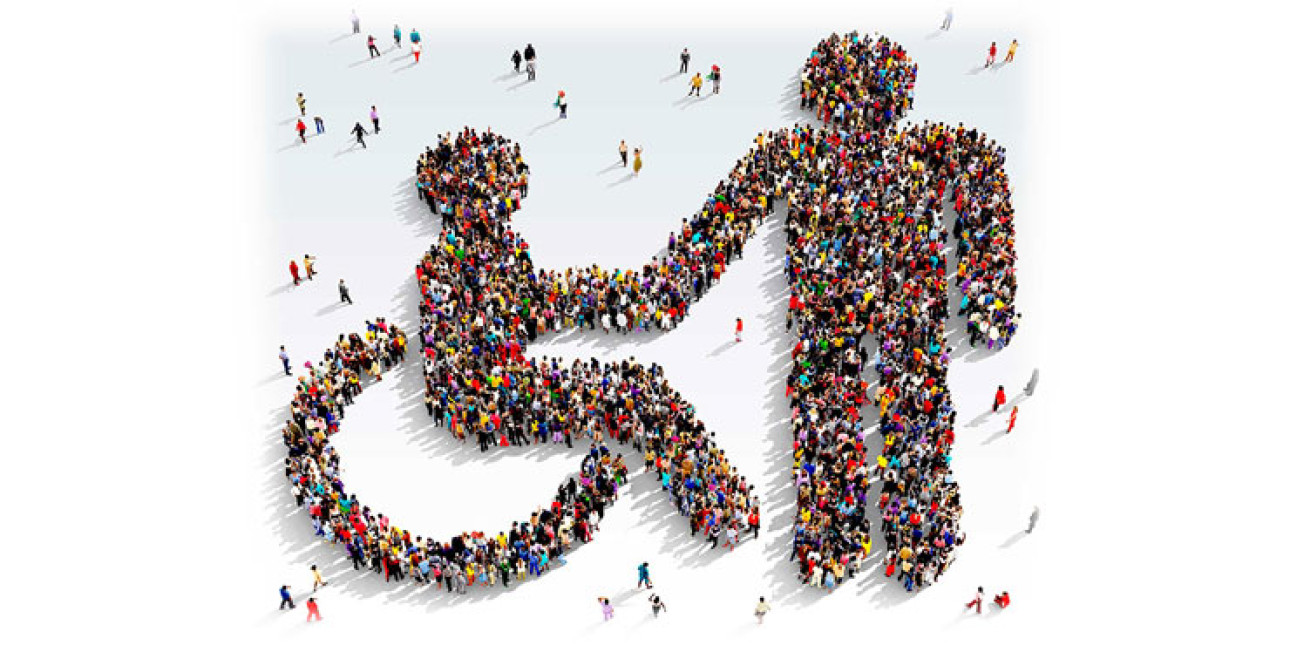 Piirretyistä ihmishahmoista muodostuva pyörätuolisymboli